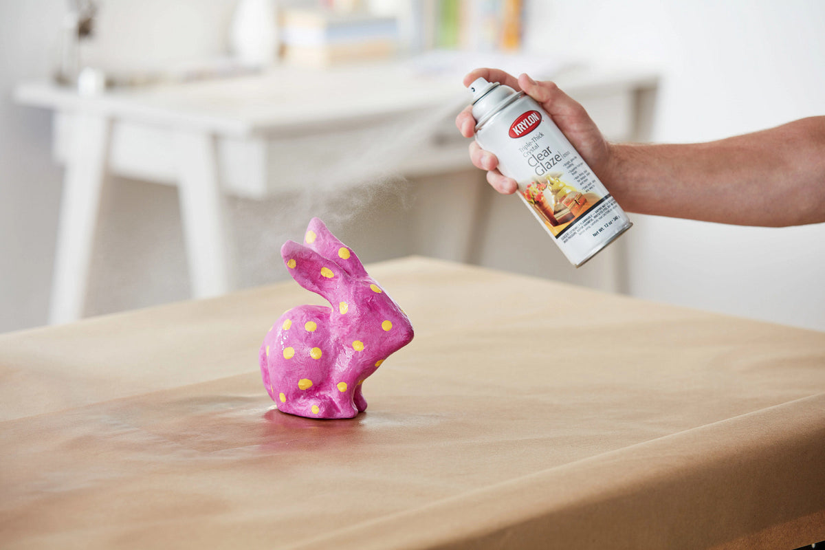 Applying Krylon Triple-Thick Crystal Clear Glaze spray to a project