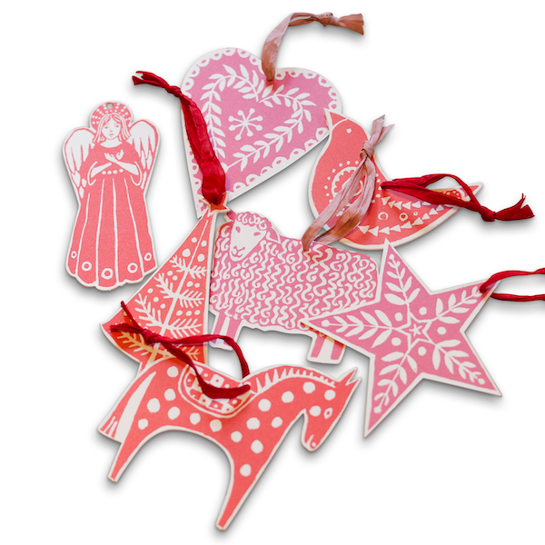 Pink and red folk-art card ornaments with ribbon loops, including an angel, heart, bird, sheep, star and horse