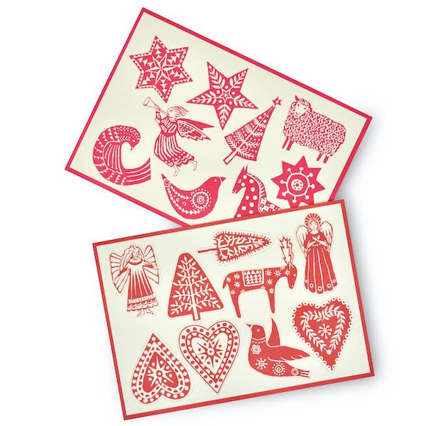 Two views of Cambridge Imprint press-out Christmas card designs featuring stars, birds, angels, hearts and animals