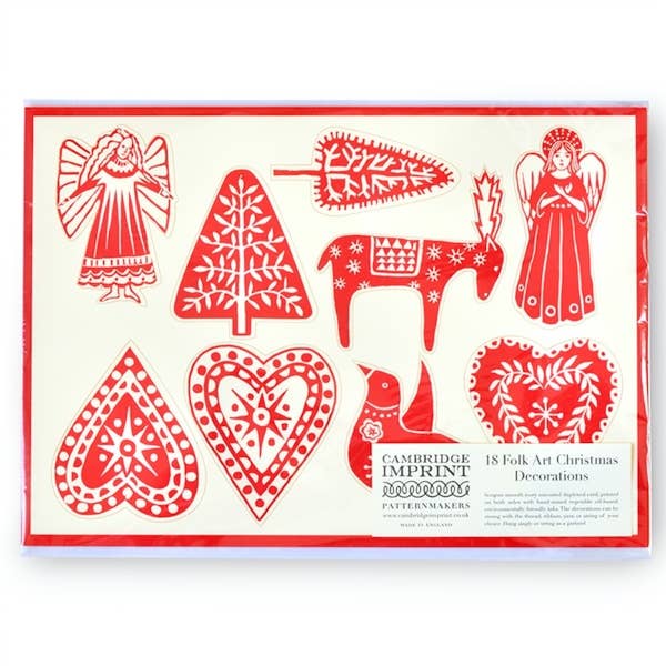 Cambridge Imprint folk-art Christmas decorations in red and ivory, including angels, hearts, trees and a reindeer